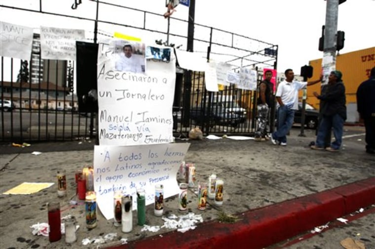 A makeshift memorial is shown Tuesday, Sept 7, 2010, on a downtown Los Angeles street for Manuel Jamines a Guatemalan immigrant who was shot and killed in a police shooting Sunday. A protest over the shooting of Jamines turned violent Monday night, when some demonstrators threw bottles at officers, set trash cans on fire and refused to disperse. (AP Photo/Nick Ut)